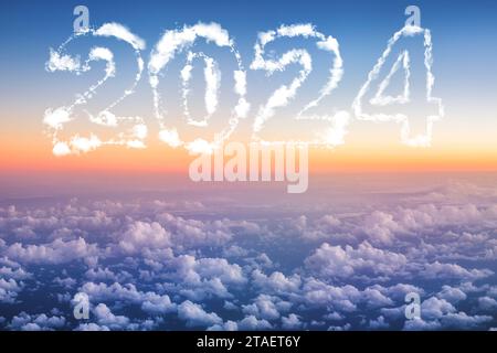 2024 Happy new year concept. Above The Clouds Photo of puffy clouds, sunset shot Stock Photo