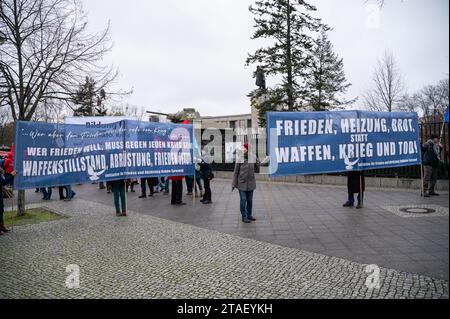 25.11.2023, Berlin, Germany, Europe - Ahead of an upcoming peace rally a group of peace activists with banners stands at the Soviet War Memorial. Stock Photo