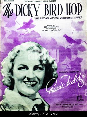 Iconic Vintage Music Sheet - 'The Dicky Bird Hop' by Gracie Fields.Classic music sheet cover featuring Gracie Fields, with vibrant purple hues. Stock Photo