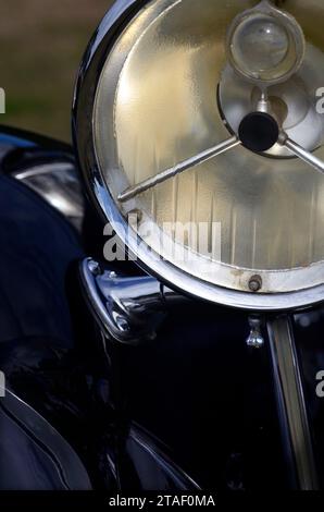 Headlight lamp vintage car. Classic car headlight. Close-up of