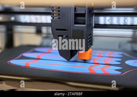 Modern 3D printer and surfboards, closeup Stock Photo