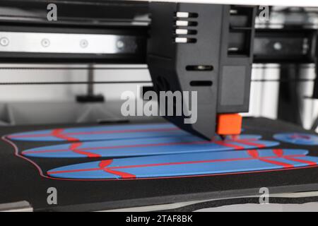 Modern 3D printer and surfboards, closeup Stock Photo