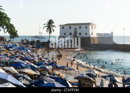 Salvador, Bahia, Brazil - October 21, 2023: View of Porto da Barra full of people bathing in the sun and sea in the city of Salvador, Bahia. Stock Photo