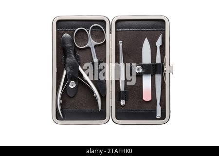 Set of steel manicure instruments and tools in black leather case isolated on white background. Stock Photo