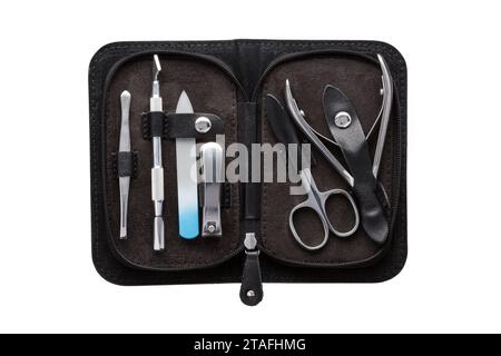Set of steel manicure instruments and tools in black leather case isolated on white background. Stock Photo