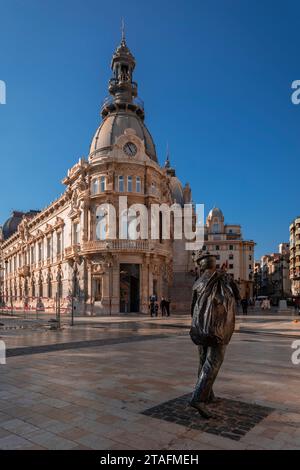 Plaza de los Heróes de Cavite in the city of Cartagena with the statue of the sailor in the foreground and the Palacio del Ayuntamiento in the backgro Stock Photo