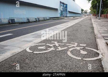 View of bicycle icon symbol on bicycle lane on the road of downtown in Bangkok, Thailand. Cycling friendly city in Thailand. Stock Photo