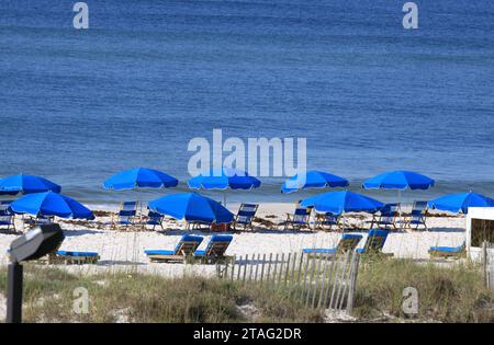 Panama City Beach front resort property in the summer with parasols and recliner chairs. Stock Photo