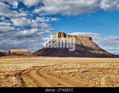 Factory Butte, isolated flat-topped sandstone mountain in Utah desert, USA Stock Photo
