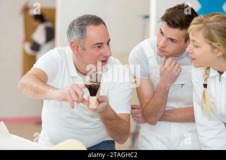 portrait of a painter with apprentices Stock Photo