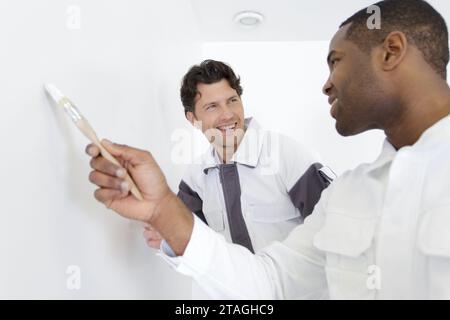 observing the brushing technique of the apprentice Stock Photo