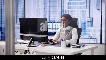 African woman using computer for business communication Stock Photo