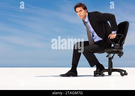 Business man on chair, dream on blue sky and decision, planning strategy and future on cloud mockup space. Serious professional consultant thinking of Stock Photo