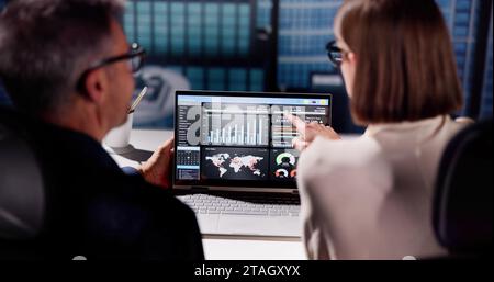 Analyzing KPIs and Report with Laptop's Graphs on Dashboard Stock Photo
