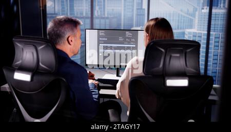 Accountant Checking Invoice for Online Payment with People Stock Photo
