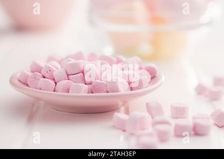 Mini sweet marshmallows candy on the plate. Stock Photo