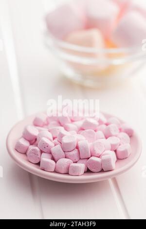 Mini sweet marshmallows candy on the plate. Stock Photo