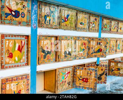 Colorful lockers at La Calera thermal waters, painted with traditional motifs and indigenous animals that populate the valley, Chivay, Peru Stock Photo