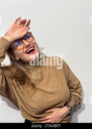 A portrait of a young Caucasian woman wearing eyeglasses. Stock Photo
