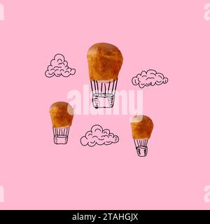 cupcakes on a pink background were finished with a balloon and clouds Stock Photo