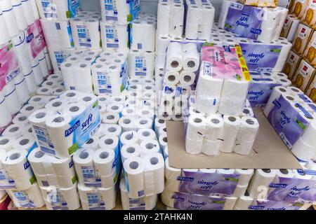 Italy - November 26, 2023: Stacked toilet paper packs displayed for sale in Italian discount store Stock Photo