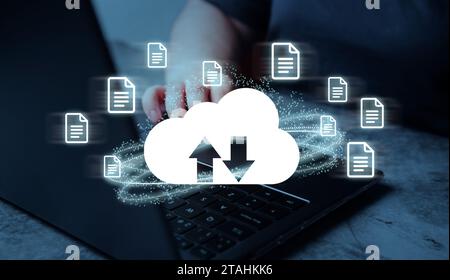 Woman use laptop with digital cloud computing diagram interface. Data storage and backup concept. Cloud technology management big data. Stock Photo