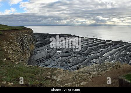 Rocky Coast at Nash Point Sealine with loose cliffs and an overcast but bright Autumn day in October on the Glamorgan Heritage Coast south Wales UK Stock Photo