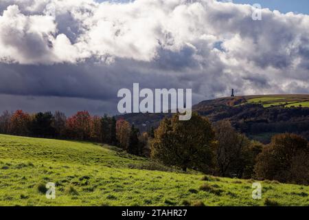 Sunlight breaks through storm clouds as they gather over the Irwell Valley at Ramsbottom, Bury, Greater Manchester. Stock Photo