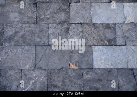 pavement path made of polished real stone as a background Stock Photo
