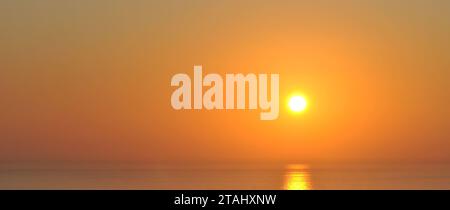 Sunset over the sea in Greece. Copy space for placement of text. Empty background teplate for designers. Stock Photo