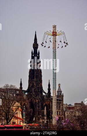 Edinburgh Scotland Christmas Fair or Market Princes Street stalls Helter Skelter Scott Monument and Star Flyer with lights Stock Photo