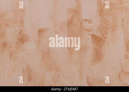 Detail of a section of an Italian building with light and dark orange paint patterns. Stock Photo