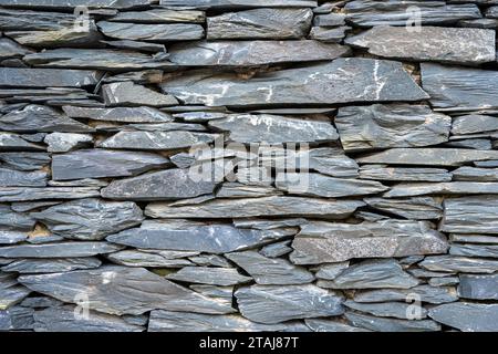 Background from an old natural slate stone wall Stock Photo