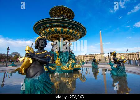 Fontaine des Mers (Maritime Navigation Fountain), one of the two monumental Concorde Fountains, near the famous Luxor Obelisk, on Place de la Concorde Stock Photo