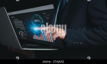 Data analysis concept. businessman analyze and visualize complex information on a virtual screen process data, Big data technology, KPI key performanc Stock Photo