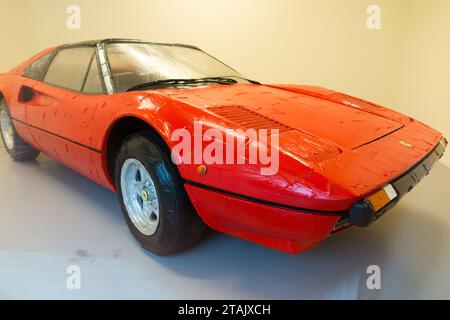 Contemporary work of art; thick red acrylic paint on a Ferrari 308 GTS car, by Bertrand Lavier. Exhibit at New National Museum of Monaco. (135) Stock Photo