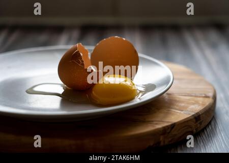 Fresh egg yolk on a plate Stock Photo