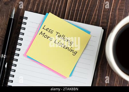 Less talking more listening text on adhesive note Stock Photo