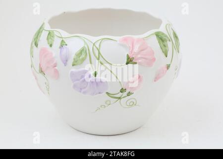 White Ceramic Bowl with Pink and Mauve Floral Design Stock Photo