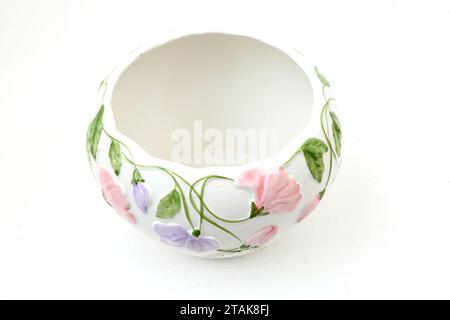 White Ceramic Bowl with Pink and Mauve Floral Design Stock Photo