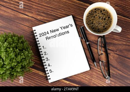 2024 goals on notepad with cup of coffee and eyeglasses, top view Stock  Photo - Alamy