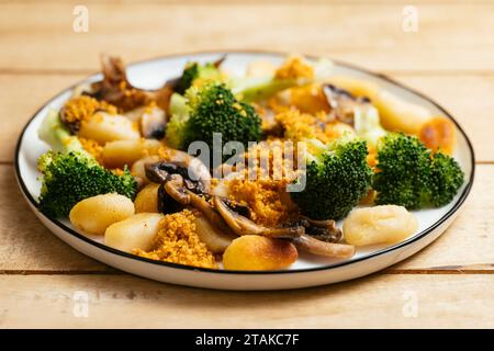 Gnocchi with Mushrooms Broccoli and Spicy Bread Crumbs Stock Photo