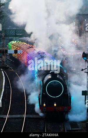 1st December 2023. Steam train illuminations Christmas event on the Watercress Line, Alresford Station, Hampshire, England, UK. The popular annual event gives people the chance to ride on an illuminated vintage steam train, lit up with colourful Christmas lights. Stock Photo