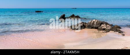 Beautiful view of Elafonisi Beach, Chania. The amazing pink beach of Crete. Elafonisi island is like paradise on earth with wonderful beach. Banner. Stock Photo