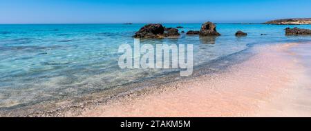 Beautiful view of Elafonisi Beach, Chania. The amazing pink beach of Crete. Elafonisi island is like paradise on earth with wonderful beach. Banner. Stock Photo