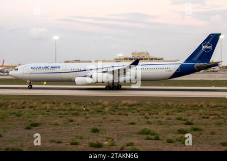 Universal Sky Carrier (USC) Airbus A340-313 (REG: D-AUSC) taking off in the light of the day. Stock Photo