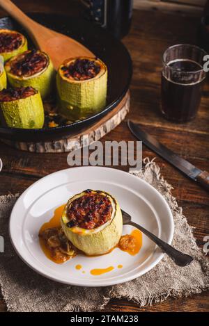 Portion of Oven Baked Zucchini Stuffed with Ground Beef Served on Plate Stock Photo