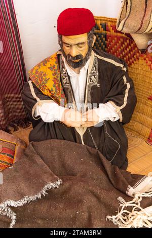 Djerba, Medenine, Tunisia. March 15, 2023. Diorama of a Tunisian man wearing a red fez at the Guellala Museum in Djerba. Stock Photo