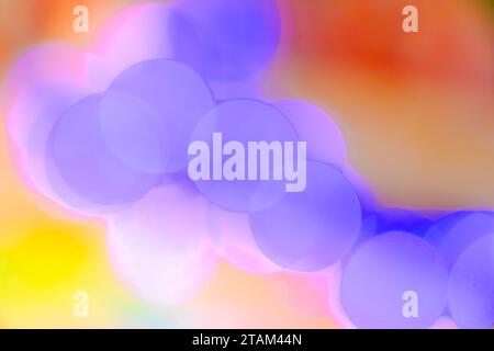 Abstract blurry colorful pastel bokeh light circles glowing, relaxing magical background Stock Photo