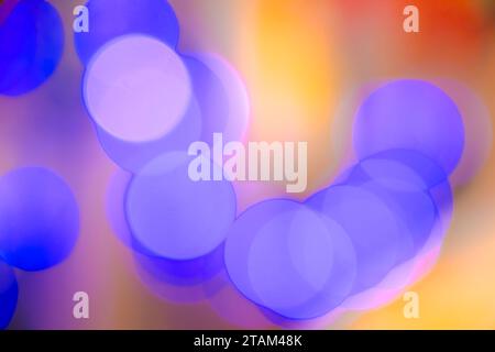 Abstract blurry purple blue soft smooth bokeh light circles glowing on colorful background, close up Stock Photo